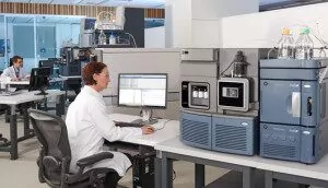 A researcher with the Xevo TQ-XS mass spectrometer. 